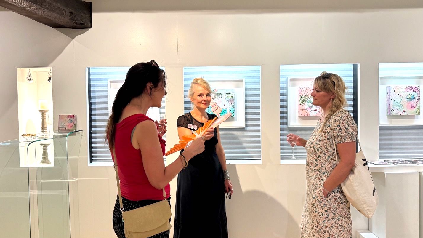Visitors in conversation during an art event